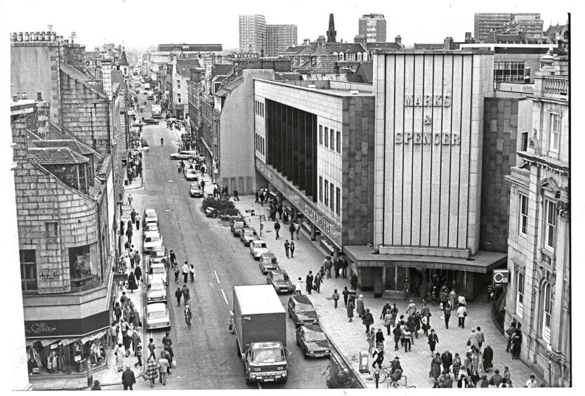 St Nicholas Street in Aberdeen before the construction of the shopping centre, people can be seen entering Marks & Spencer