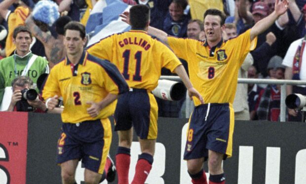 Craig Burley is hailed by John Collins after equalising for Scotland. against Norway at France '98. Image: SNS.