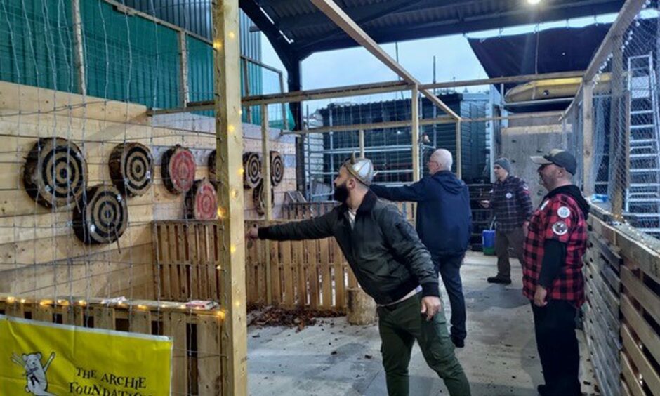 Viking Surgeon Association attendees throw axes at Ace Targets Skye