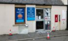 Burghead post office after break-in, smashed glass door