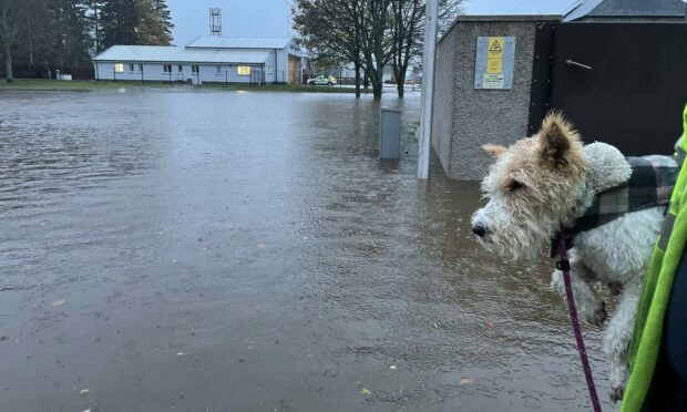 Residents in Ballater brace themselves for severe flooding as torrential rain sweeps across the region. Image: Supplied.