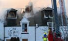 The derelict Old Mill Inn went up in flames last February. Image: Kenny Elrick/DC Thomson