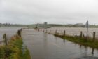 River Don has burst its banks flooding the surrounding area near Kintore. Image: Paul Glendell/ DC Thomson.