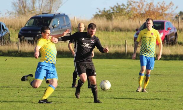 Paul Gair, of St Duthus, in action in the recent 2-2 league draw with Orkney. Image: St Duthus FC