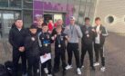 The delighted Inverness City ABC boxers and coaches following their success at the Scottish Development Championships at Ravenscraig. Image: Inverness City ABC