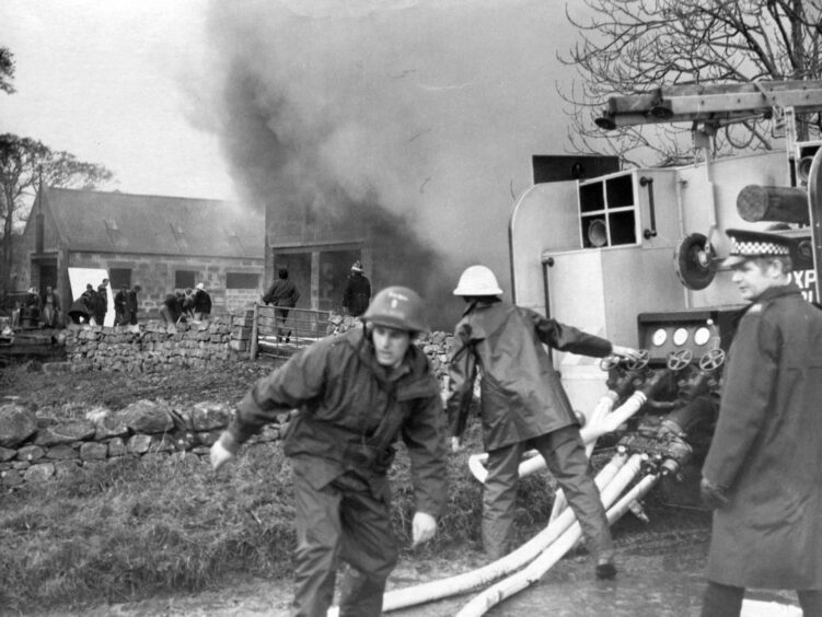RAF firefighters using a Green Goddess to put out a fire at Echt