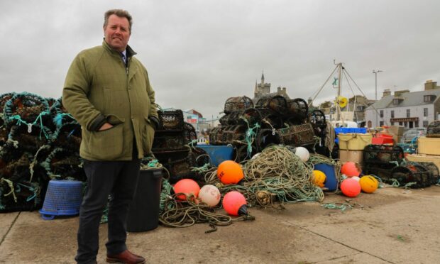 Fisheries Minister Mark Spencer, pictured during a visit to a north-east fishing port. Image: Defra