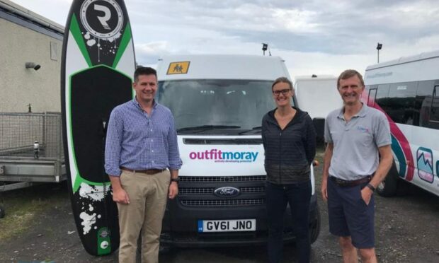 Tony Brown (chief executive), Heather Stanning and Tony Gabb (trustee) at Outfit Moray. Image: Outfit Moray.