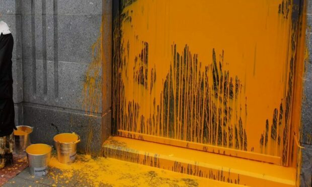 Paint was splashed across windows at the Silver Fin. Image: Extinction Rebellion.