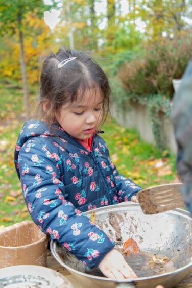 Child engaging in outdoor play at the International School of Aberdeen