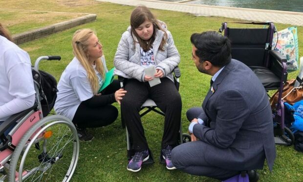 Helen Goss, and her daughter Anna, meeting Health Secretary Humza Yousaf outside the Scottish Parliament.