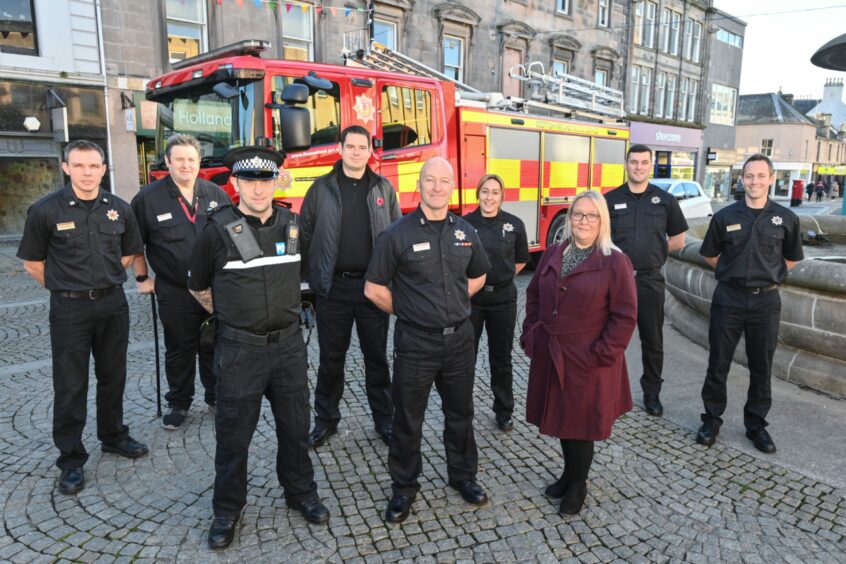 Andy Munro Crew Commander, Stuart Mount Community Safety Advocate, Jamie Dey Community Police Officer, Richard Russell Crime Reduction Officer, Alan Weston Watch Commander, Sarah Wu Firefighter, Angela Norrie (Elgin BID Manager), Scott Brant Firefighter, Alisdair Wardlaw Firefighter. Picture by Jason Hedges