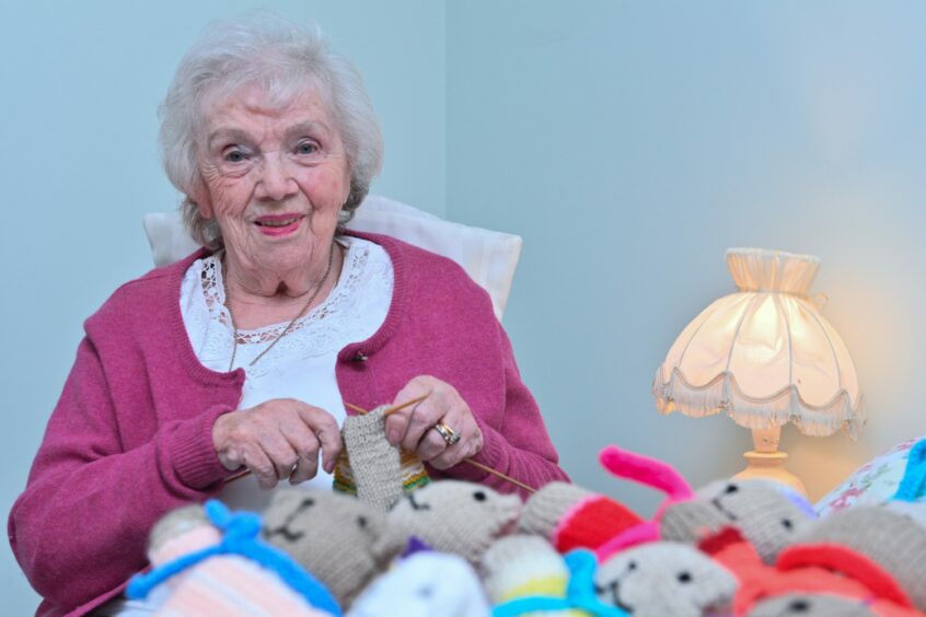Elgin grandmother Joyce Wilson sat with her teddy bears as she knits another one