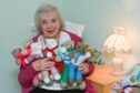 Elgin grandmother Joyce Wilson with her teddy bears she knits for charity