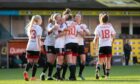 Aberdeen Women celebrate with Bayley Hutchison after her goals secured a 2-1 win over Dundee United at Tannadice. Image: Kim Cessford/DC Thomson.