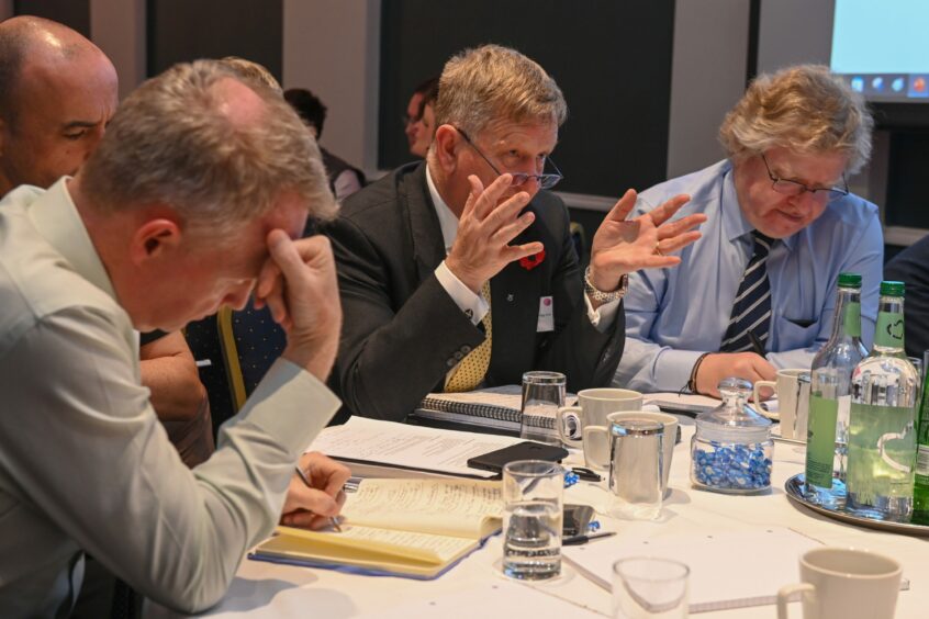 At an emergency summit on the fate of Union Street last week, council co-leaders Alex Nicoll (centre) and Ian Yuill (right) spelled out the financial straits the council is in. Could Aberdeen FC's new stadium be impacted? Image: Kenny Elrick/DC Thomson.