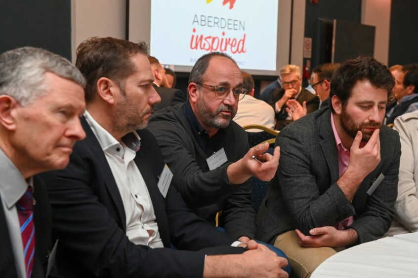 George Street trader Stuart Milne, north-east Conservative MSP Douglas Lumsden, hospitality operator John Wigglesworth and SNP councillor Michael Hutchison deep in conversation at the Union Street summit. Image: Kenny Elrick/DC Thomson.