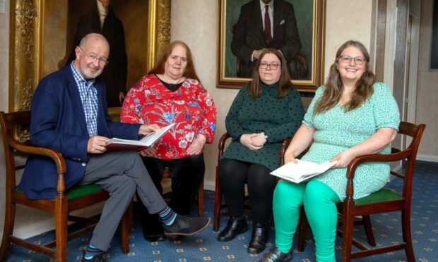 The authors of a new book about the history of childbirth in Aberdeen and the north-east meet at a portrait of Sir Dugald Baird at Aberdeen Medico-Chirurgical Society Medical School, Foresterhill. From left, Prof George Youngson, Lesley Dunbar, Fiona Rennie and Alison McCall.