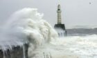 Crashing waves near lighthouse