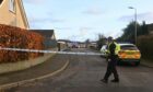Police were stationed around Hunter Place in Stonehaven on Monday. Image: Kath Flannery / DC Thomson