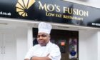 Mo Omar Faruk outside his newly-opened restaurant in Peterhead, Mo's Fusion. Image: Kami Thomson/DC Thomson.