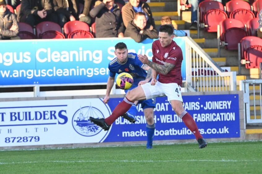 Cove Rangers' Mitch Megginson and Arbroath's Ricky Little. Image: Kami Thomson/DC Thomson