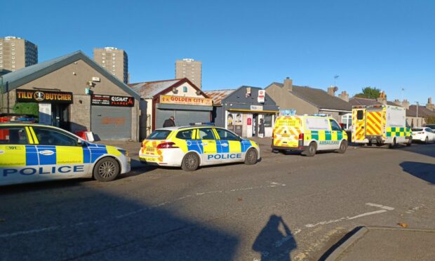 Police cars and ambulances on Hayton Road. Image: Cameron Roy / DC Thomson.