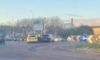 Police are in attendance at a crash on a major Bridge of Don roundabout during morning rush hour.