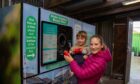 Youngsters using the Orkney DRS pilot reverse vending machines. Image: Thora Cant/Zero Waste Scotland.