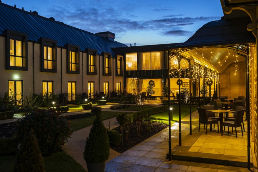 The courtyard of the Ness Walk Hotel in the evening