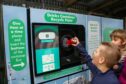 Once Scotland's Deposit Return Scheme is up and running, bottles and cans will typically come with an extra 20p deposit you can only get back by recycling it through a Reverse Vending Machine. Image: Zero Waste Scotland