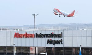 easyJet plane taking off from Aberdeen International Airport.