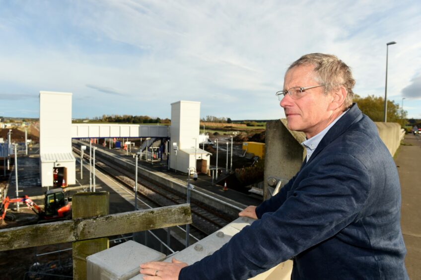 Frank Roach, partnership manager for the regional transport body Hitrans, looking over the Inverness Airport Railway development