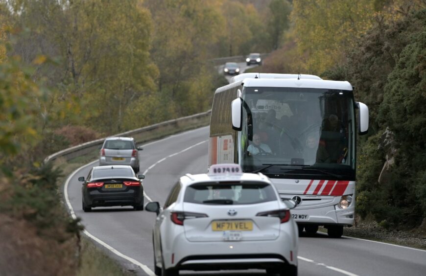 Highland accident blackspot the A82 near Lochend between Inverness and Drumnadrochit with cars and a bus shown on a bend
