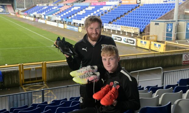 Daniel Lamond (left), assistant manager of the Caley Thistle Trust, and first-team midfielder Lewis Nicolson promote the winter boot launch. Image: Sandy McCook/DC Thomson