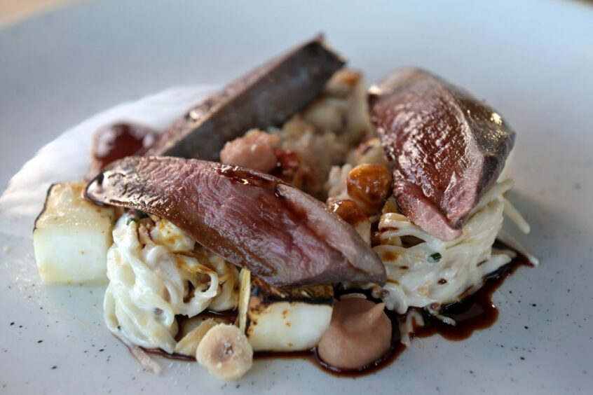 A well-presented dish of wood pigeon and celeriac