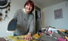 Gillian from Inverness loves spending up to five hours a day on her days off with her iron making survival blankets for the homeless. Images: Sandy McCook/DC Thomson.