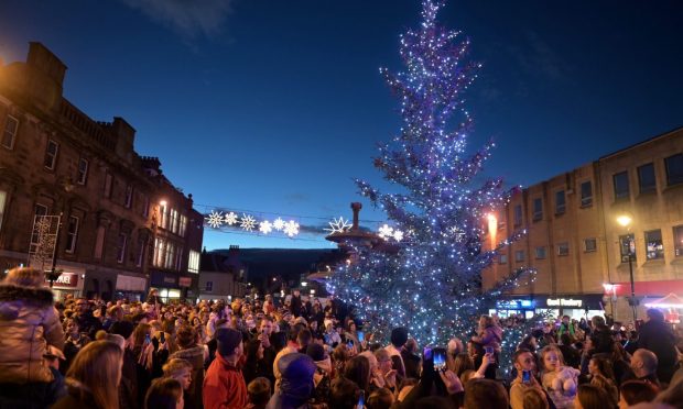 People gathered to watch the elgin christmas lights switch on