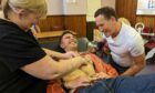 Michael Karl-Lewis gets his chest waxed to get into character of Peter Pan. Also pictured is his HMT panto co-star Brendan Cole. Image: Callum Main/ DC Thomson.