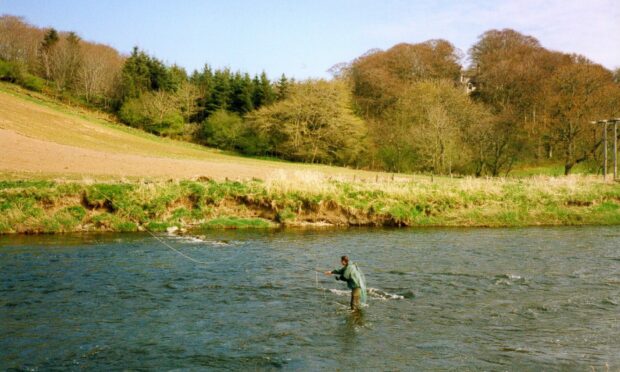 Two north-east anglers, Paul Cuthbertson and Brian Reid, have produced a book covering their own fishing tales. Pictured is Paul casting out his fly at the River Deveron. Image: Paul Cuthbertson.