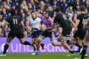 Captain Jamie Ritchie leads the charge against New Zealand.