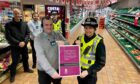 Front: Union Street Co-op store manager Dan Watt and Inspector Claire Smith. Back, left to right: crime reduction officer Pc Mark Irvine, Co-op employee Jamie McLennan and Pc Steven Sharp of the City Centre Problem Solving Team. Image: Police Scotland