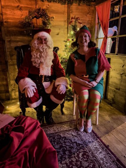 Santa and an elf in Bon Accord Centre, Aberdeen.