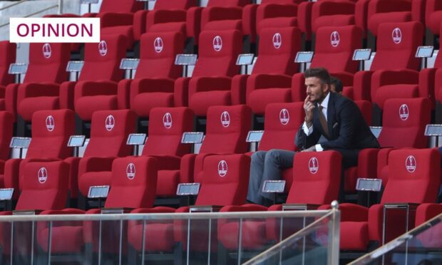David Beckham looks on from the stands at the Qatar World Cup (Image: Kieran McManus/Shutterstock)
