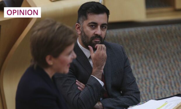 Health Secretary Humza Yousaf watches First Minister Nicola Sturgeon speak in Holyrood (Image: Fraser Bremner/Scottish Daily Mail/PA)