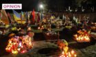 Lit candles, lamps, flowers and flags seen at the Lviv graves of Ukrainian soldiers who died in the ongoing war with Russia (Photo: Mykola Tys/SOPA Images/Shutterstock)