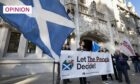 Protesters gather in London ahead of a Supreme Court hearing on the legality of a second Scottish independence referendum. (Image: Peter MacDiarmid/Shutterstock)