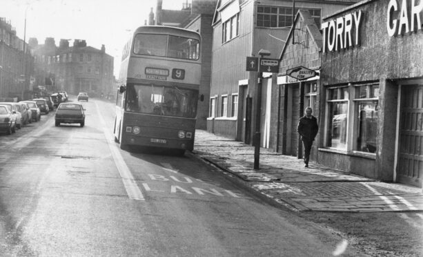 A bus heads down Menzies Road in Torry in 1981. Image: DC Thomson.