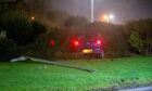 The car came to a stop in the bushes in the middle of the roundabout. Image: Wullie Marr/DC Thomson