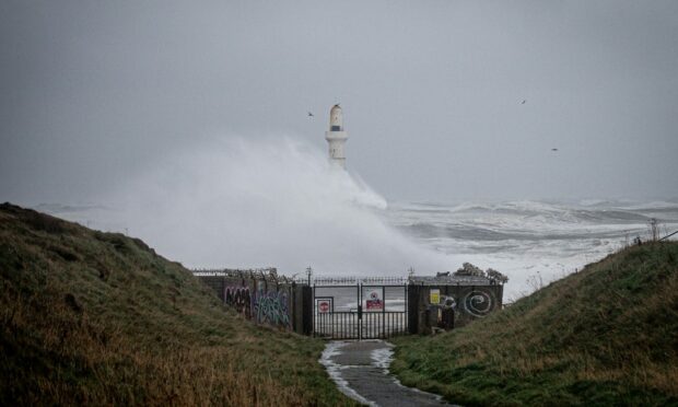 Waves crash over the Torry Battery on Thursday. Image: Wullie Marr/ DC Thomson.
